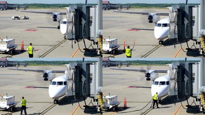 一架飞机滑行到机场的登机口。