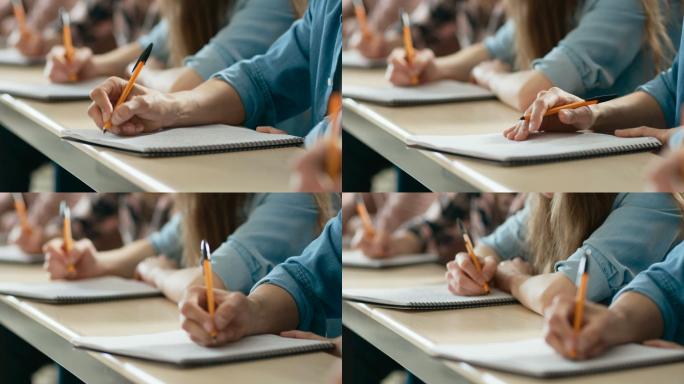 学生在笔记本上写字、参加考试的特写镜头。