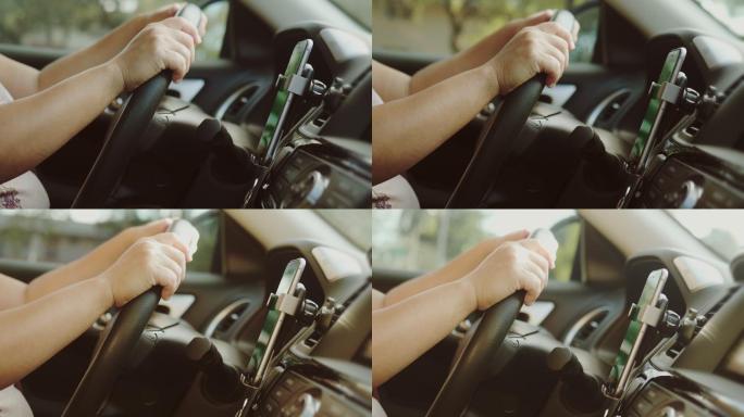 女性在车内使用智能手机的特写镜头