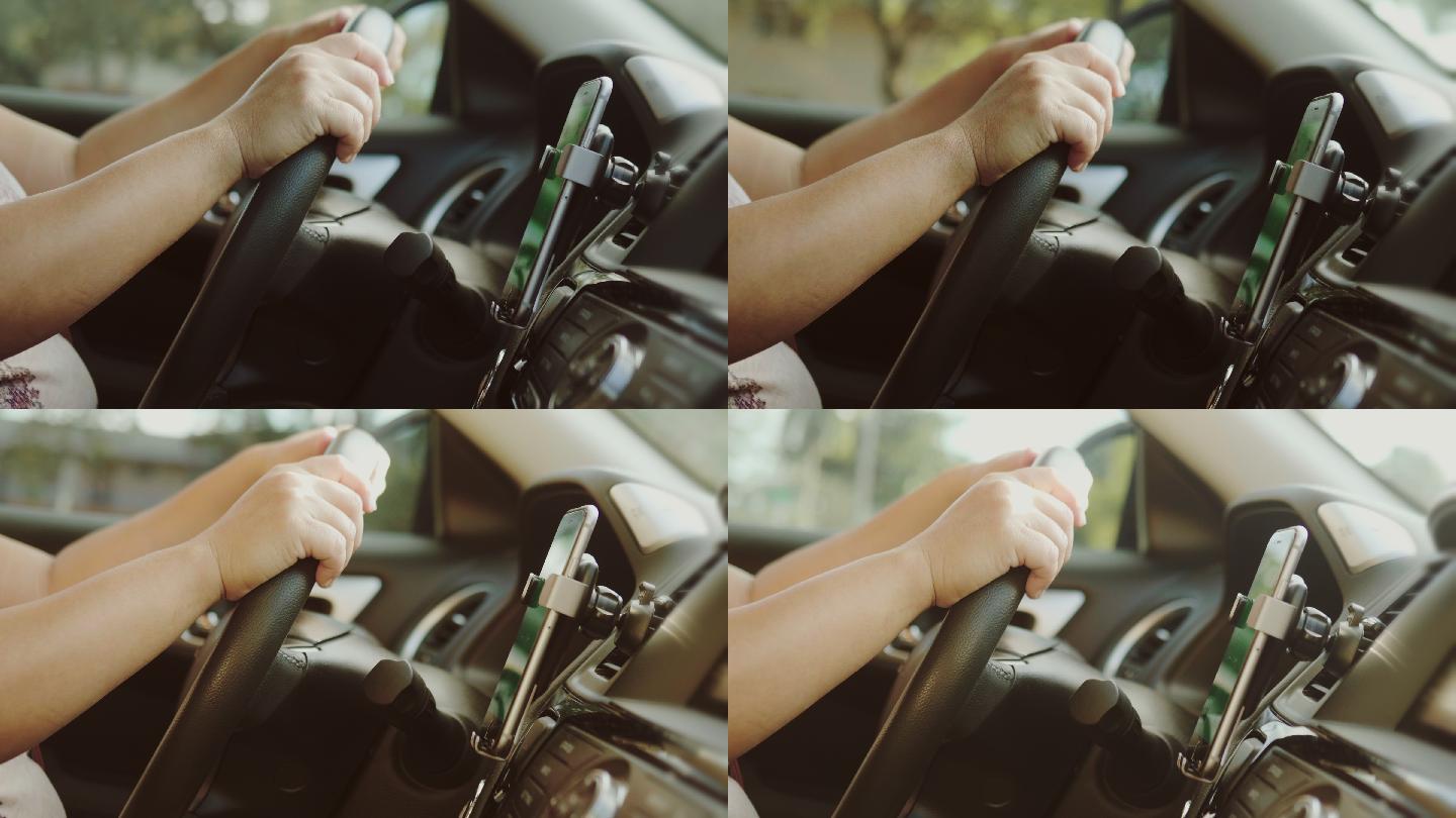 女性在车内使用智能手机的特写镜头