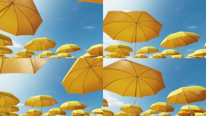 蓝色天空背景下的黄色沙滩伞