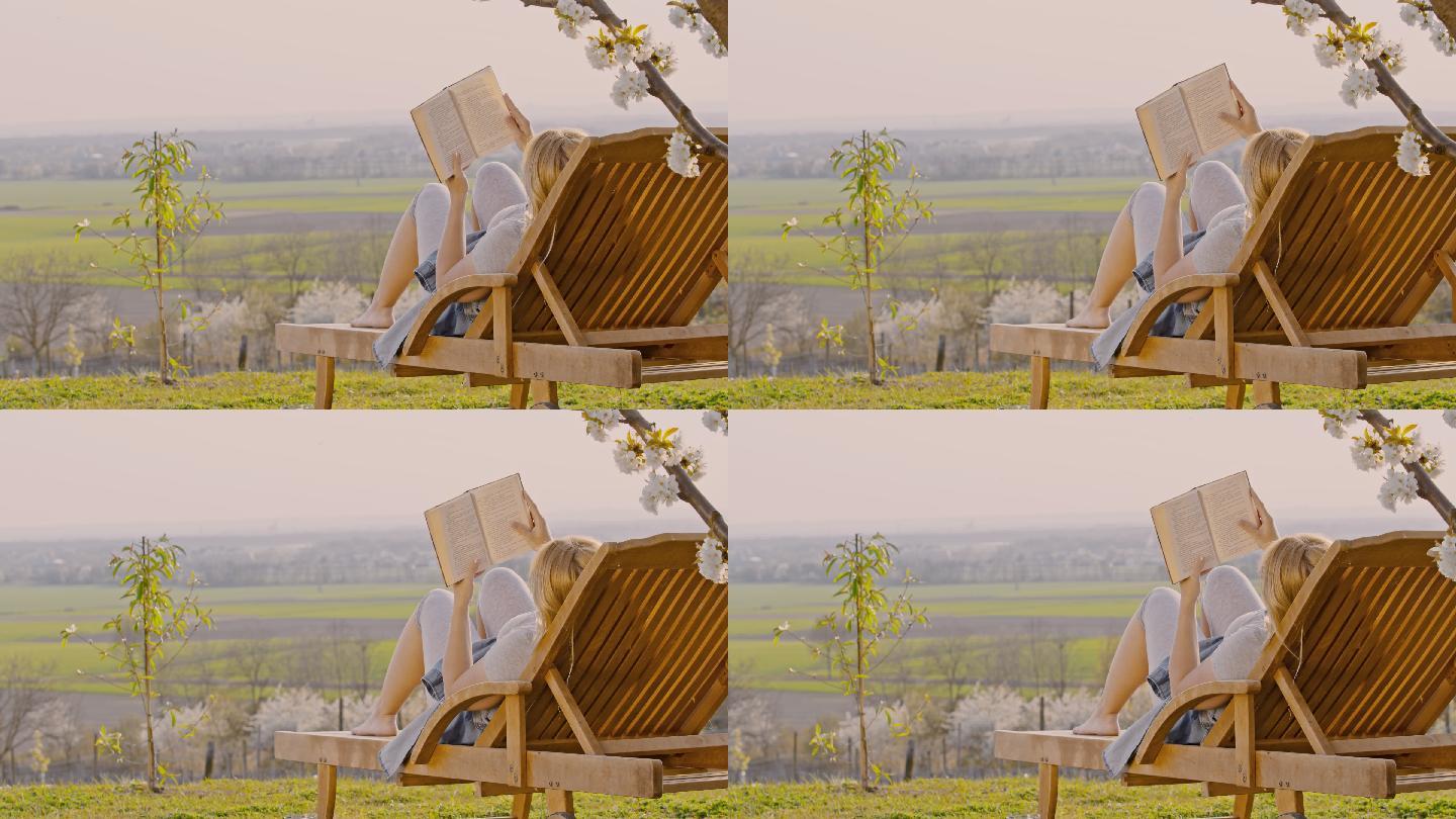 年轻女子躺椅上放松和看书