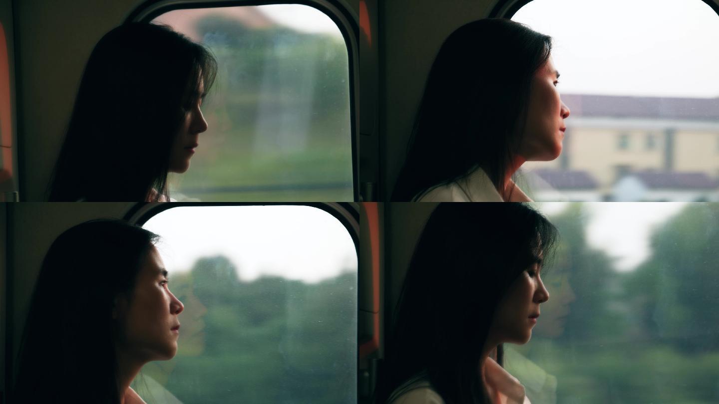 高铁车窗边看风景的女孩侧脸4k视频素材