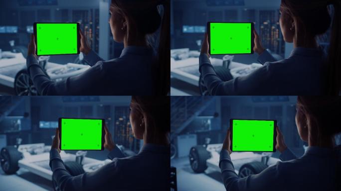 女工程师手持绿屏的平板电脑