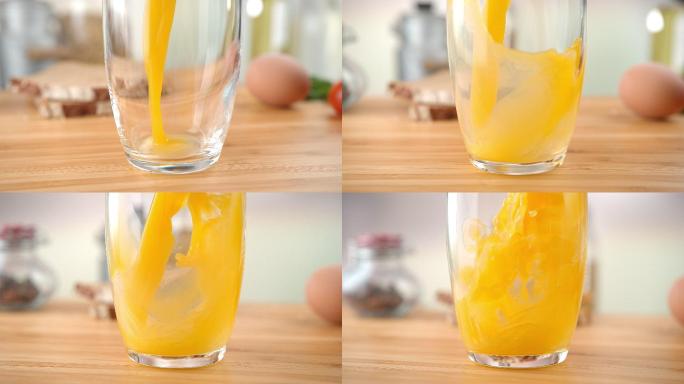 把橙汁倒进玻璃杯养生膳食健康营养美味清淡