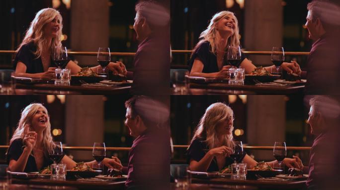 优雅的老年夫妇在餐厅享受浪漫晚餐