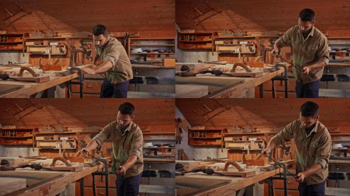 男木匠在他的店里用拉刀塑造一块木头