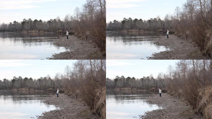 女人独自走在河边的小路上