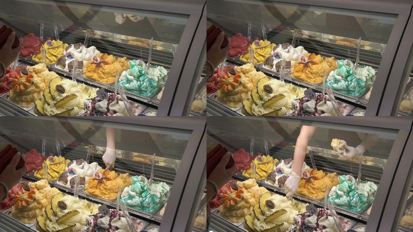 从陈列柜里舀出冷冻冰淇淋