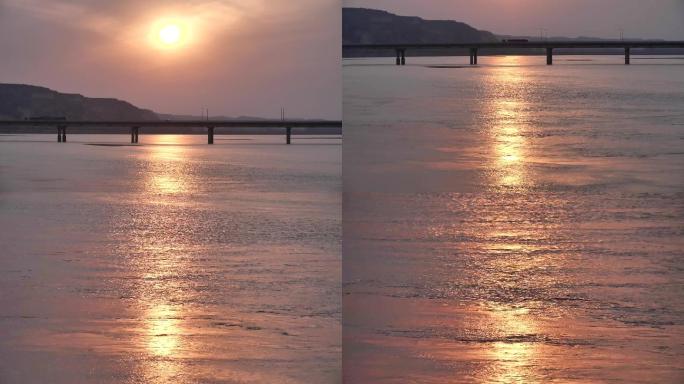 金色的黄河水和夕阳下的黄河大桥