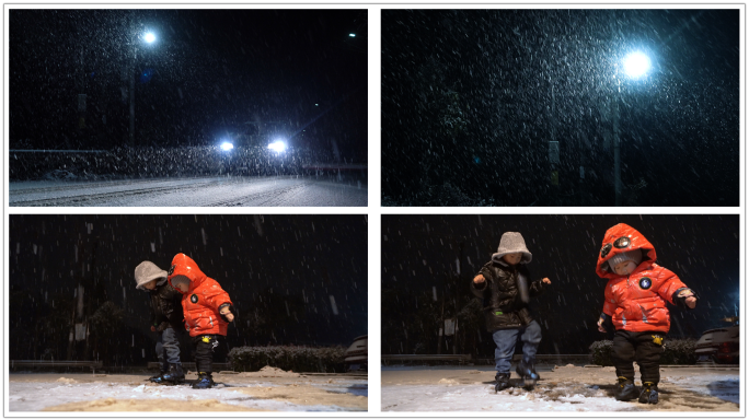 大雪夜晚孩子开心玩雪