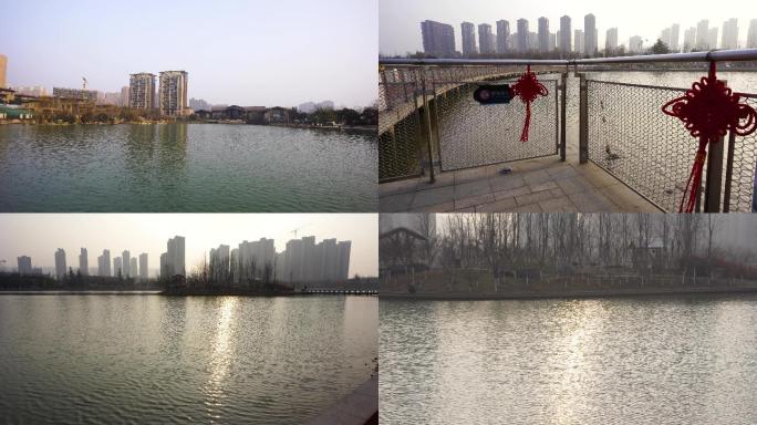 雁鸣湖公园清晨行人散步湖水长桥4k