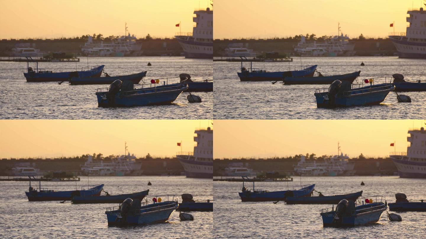 海边夕阳下停靠的船只渔船