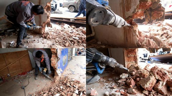 电动工具冲击钻拆墙工人在作业拆砖墙装修
