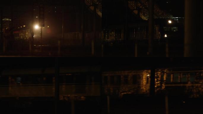 绿皮火车，昏暗的城市，夜景中行驶的