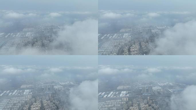 漯河市云雾航拍上升显示城市风景
