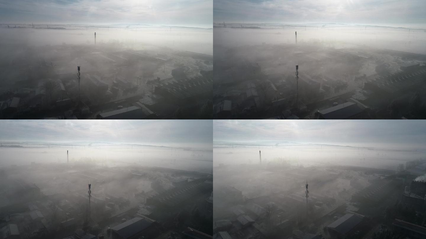 航拍冬季晨雾中的农村工厂居民区