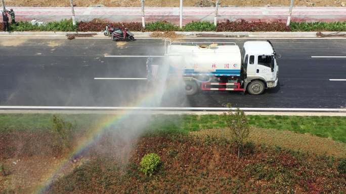 航拍道路园林绿化施工洒水车彩虹4K