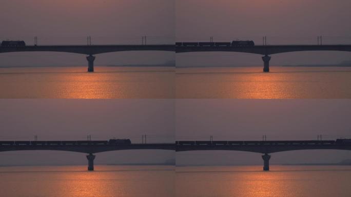 货车火车在美丽夕阳时分驶经松花江铁路桥2