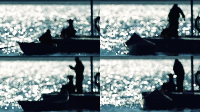 海面波光粼粼渔民将渔船靠岸虚幻大光圈唯美