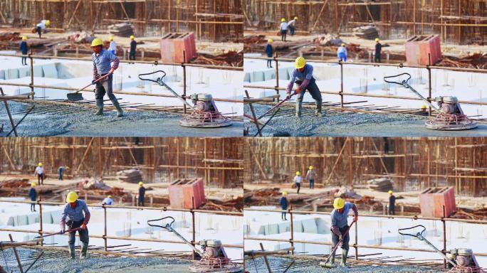 建筑工人在浇水泥