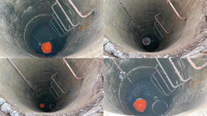 城市地下管道工人施工地下水管安全帽