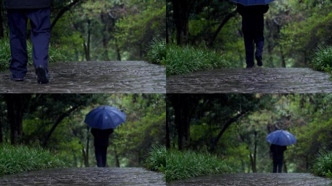 孤单 寂寥 雨天行人走过石板路