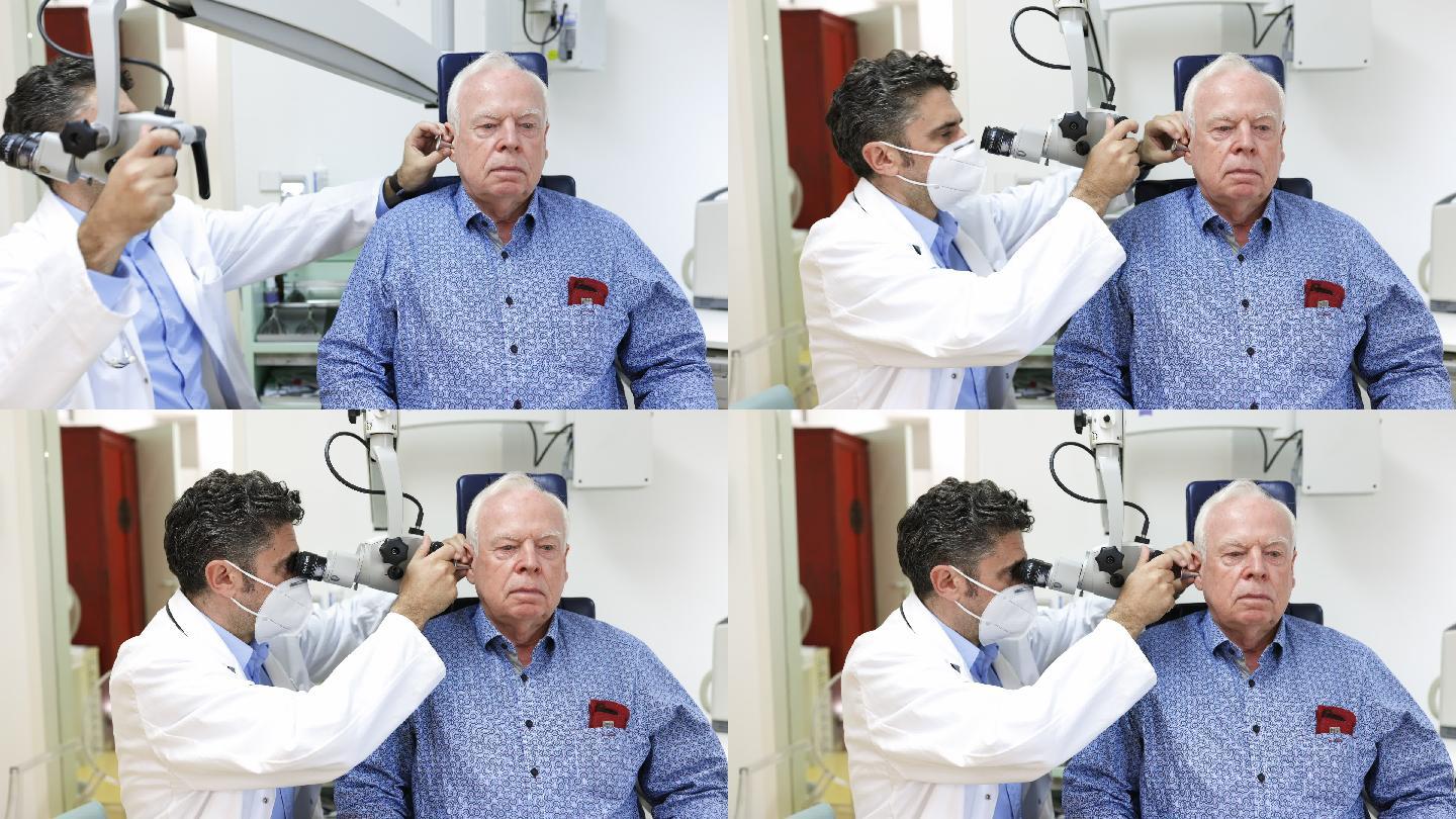 耳鼻喉科医生检查一位老人的耳朵