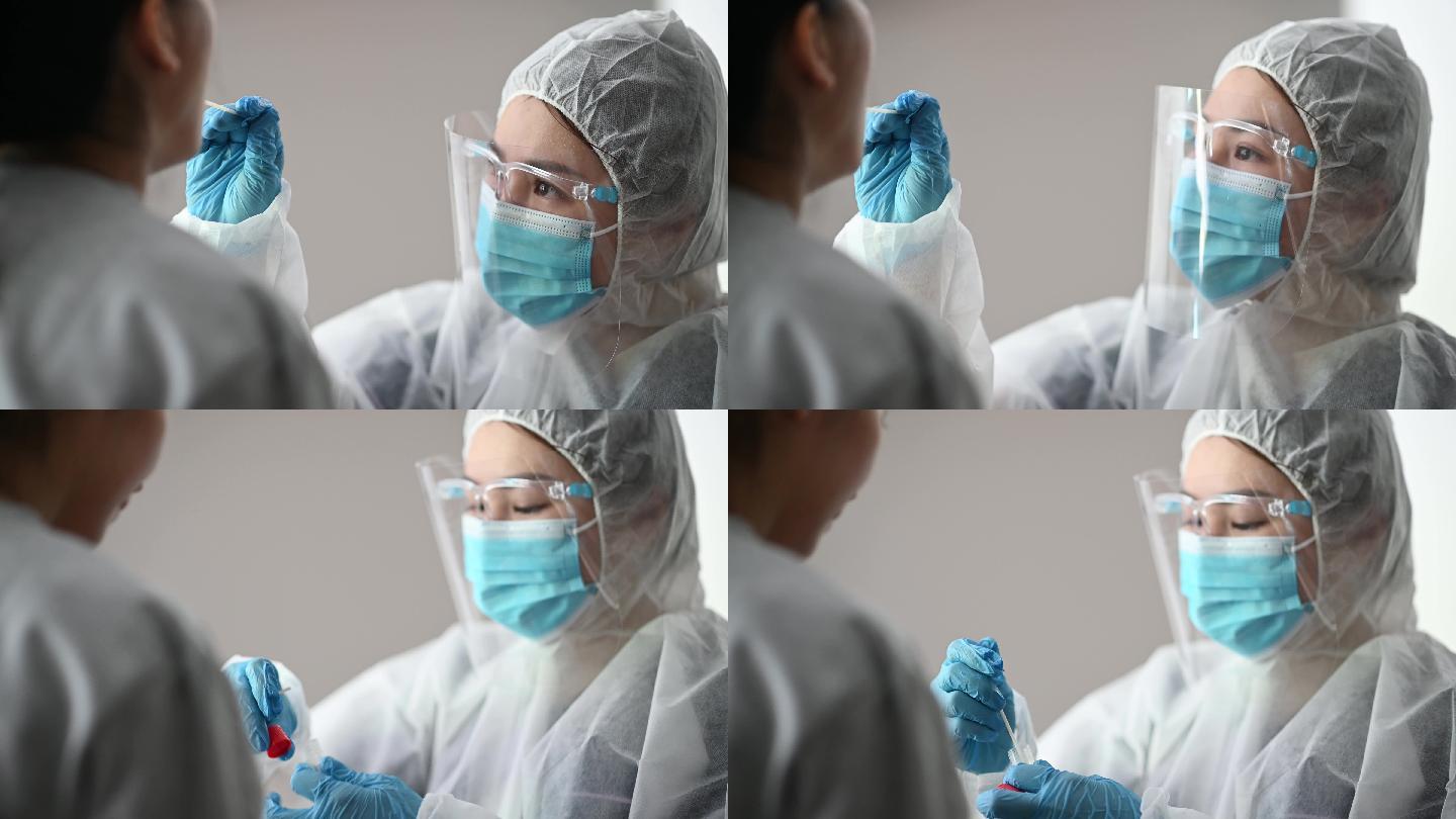 女医生从患者冠状病毒检测中取出口腔拭子。