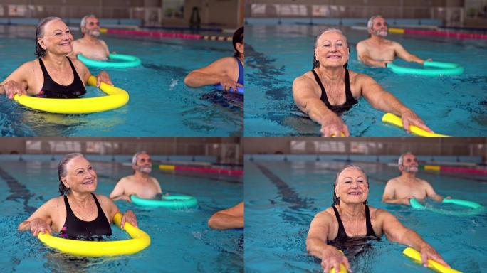 老年女子在水上健美操课上锻炼
