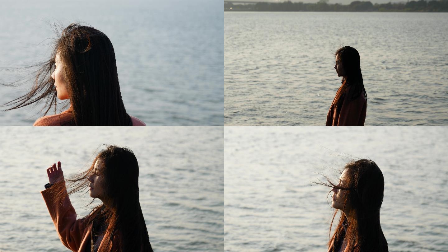 女孩在江边吹风伤感情绪4k视频素材