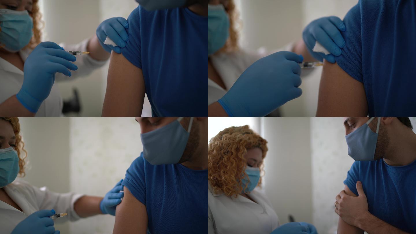 在患者手臂上接种疫苗