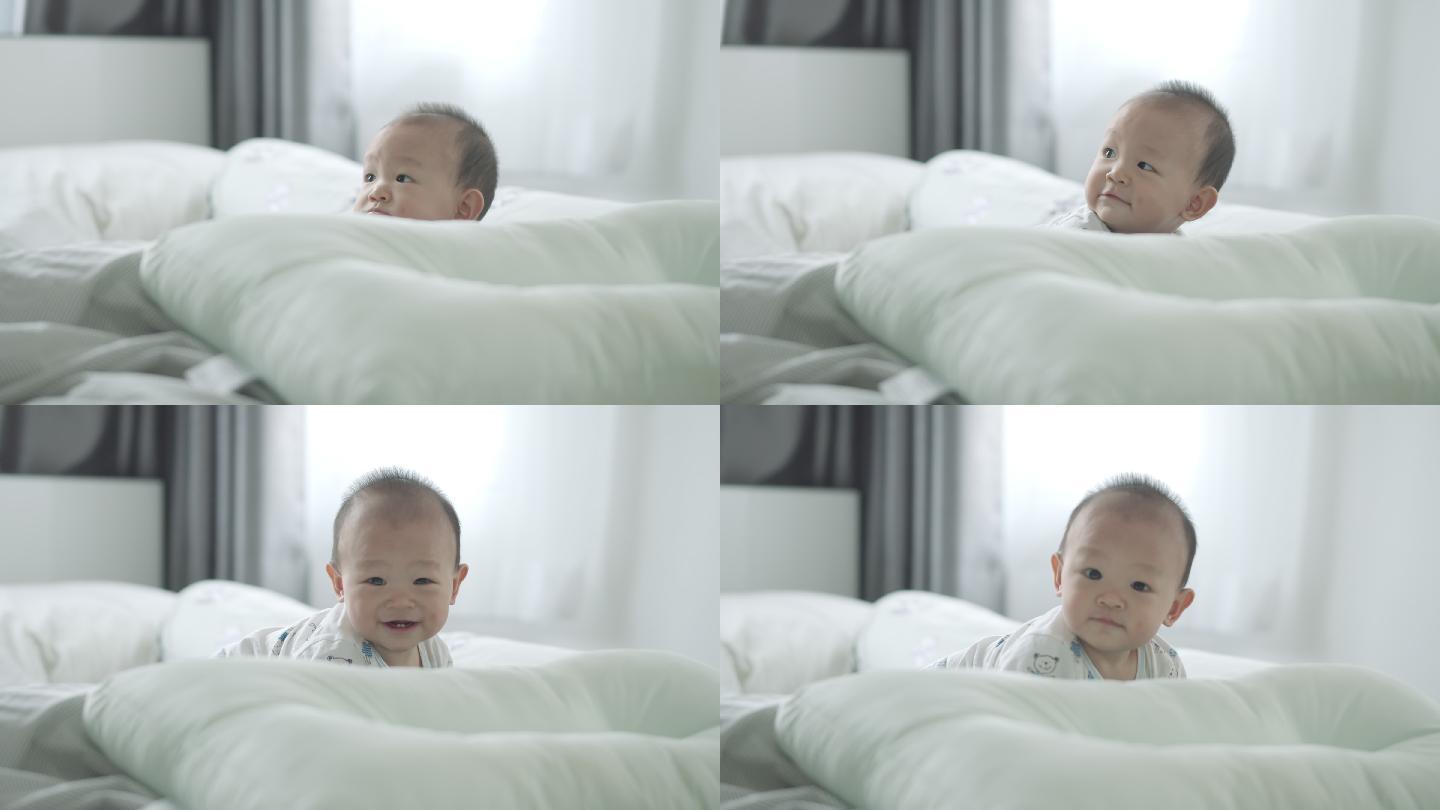 可爱的小男孩在床上爬行