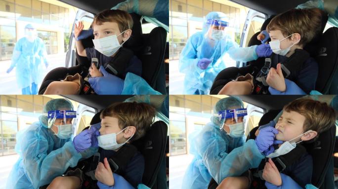 护士对一个小男孩进行了CVID-19测试