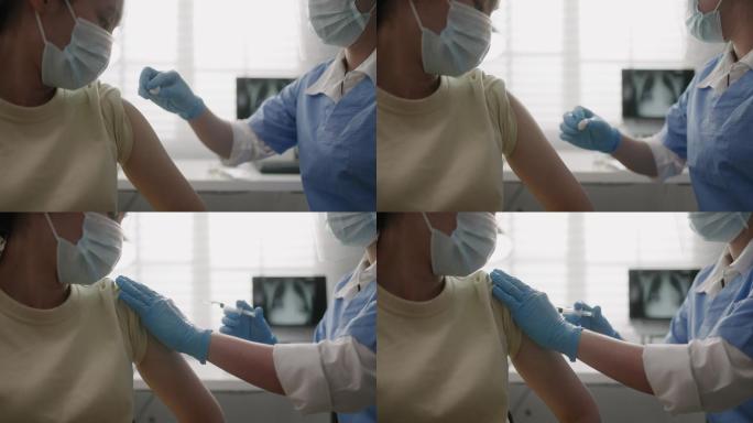 女护士给女病人注射疫苗