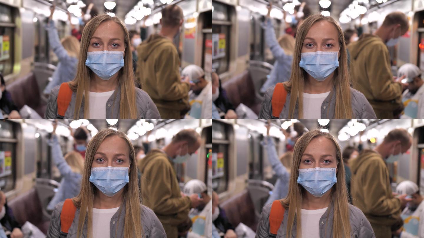 地铁上戴着口罩的女人