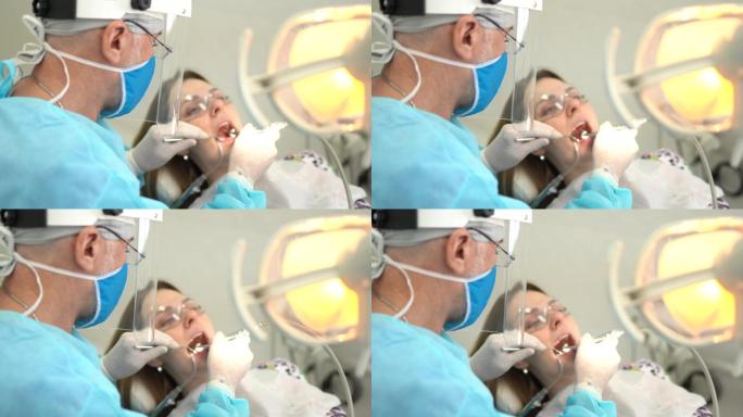 牙医检查一位年轻女子的牙齿