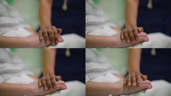 护士握住病人的手安慰关怀细致