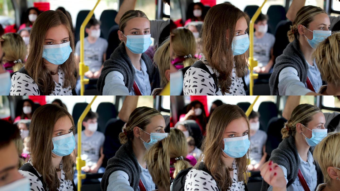 公交车上的乘客戴着防护口罩