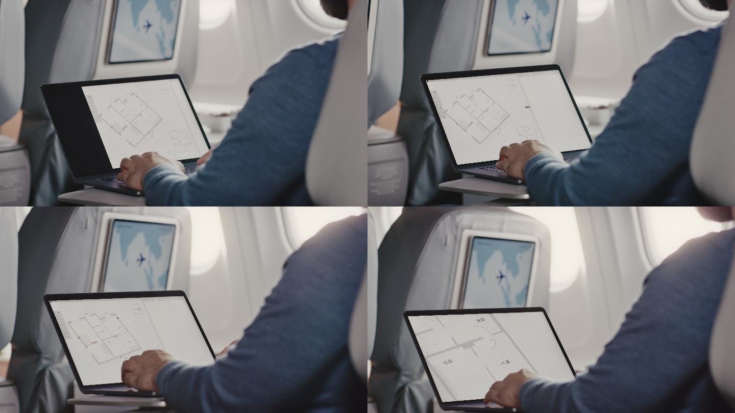 飞机上使用笔记本电脑的男子