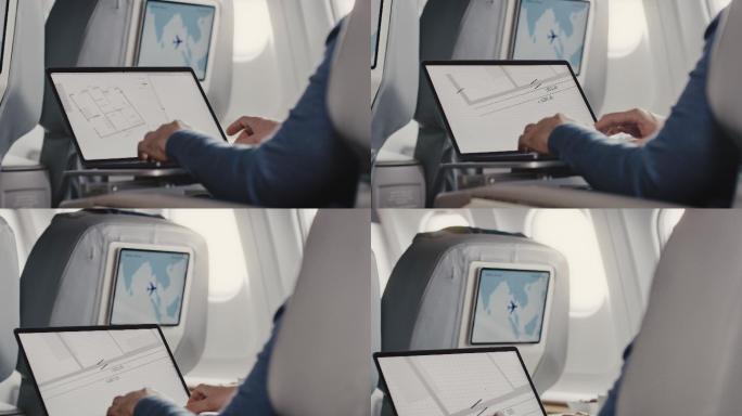 飞机上使用笔记本电脑的人