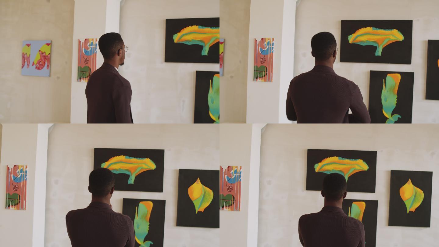 男子在美术馆看抽象画
