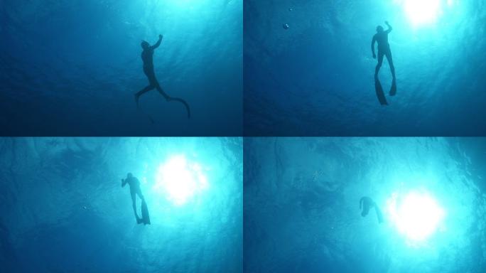 一名潜水员在海洋中潜水的慢镜头