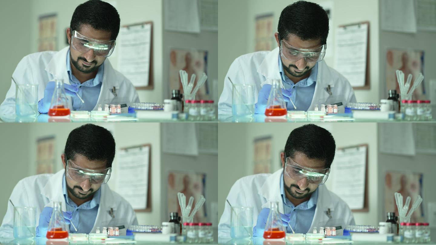 医学研究人员仔细检查和测量液体。