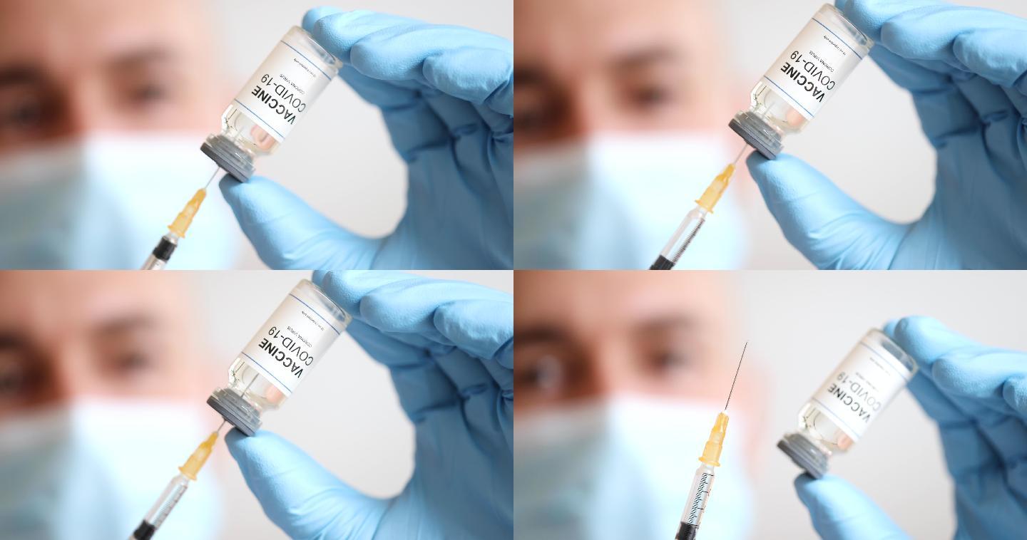 医生用注射器注射疫苗