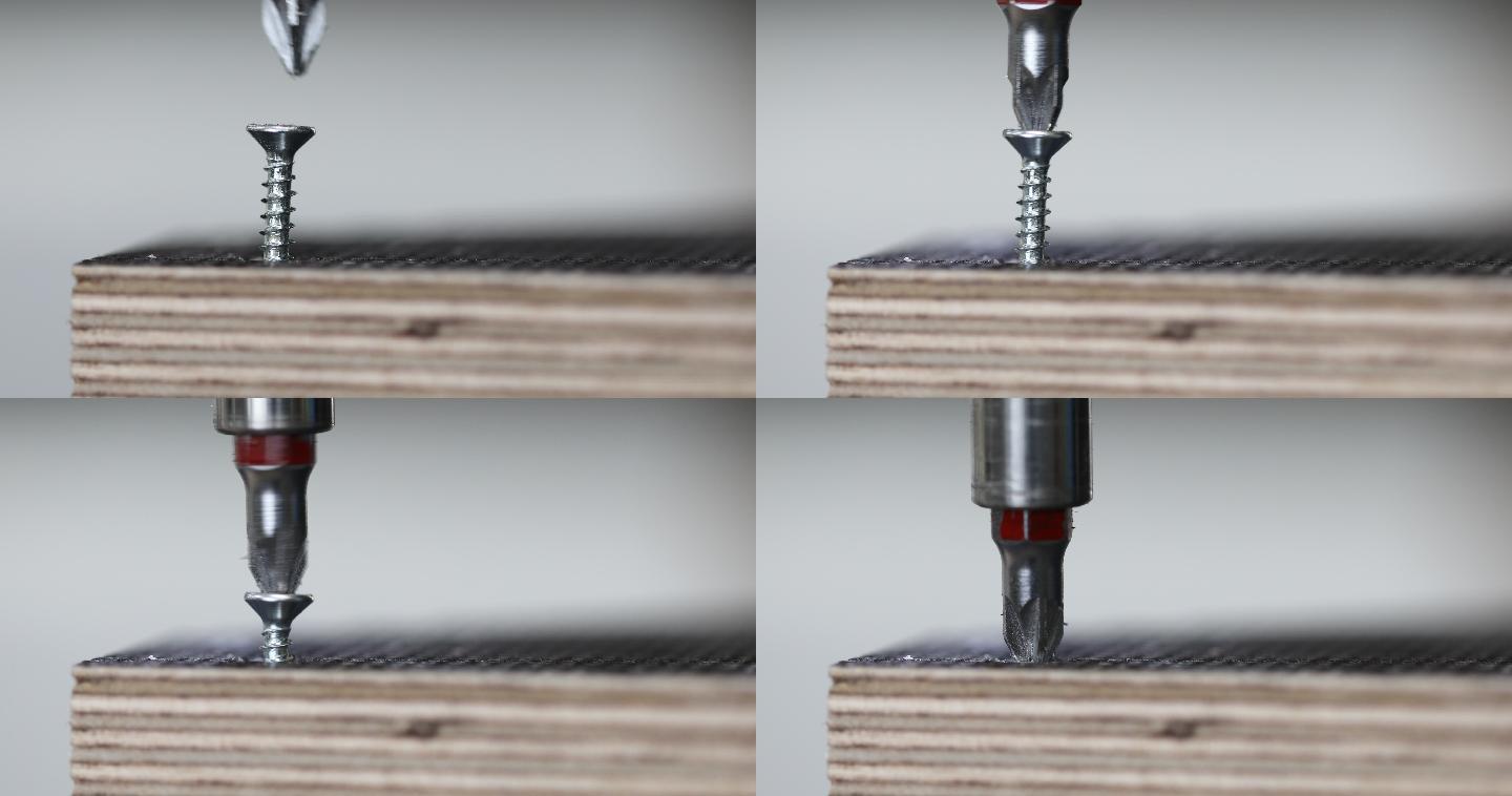 电钻把螺丝钉在木板上。