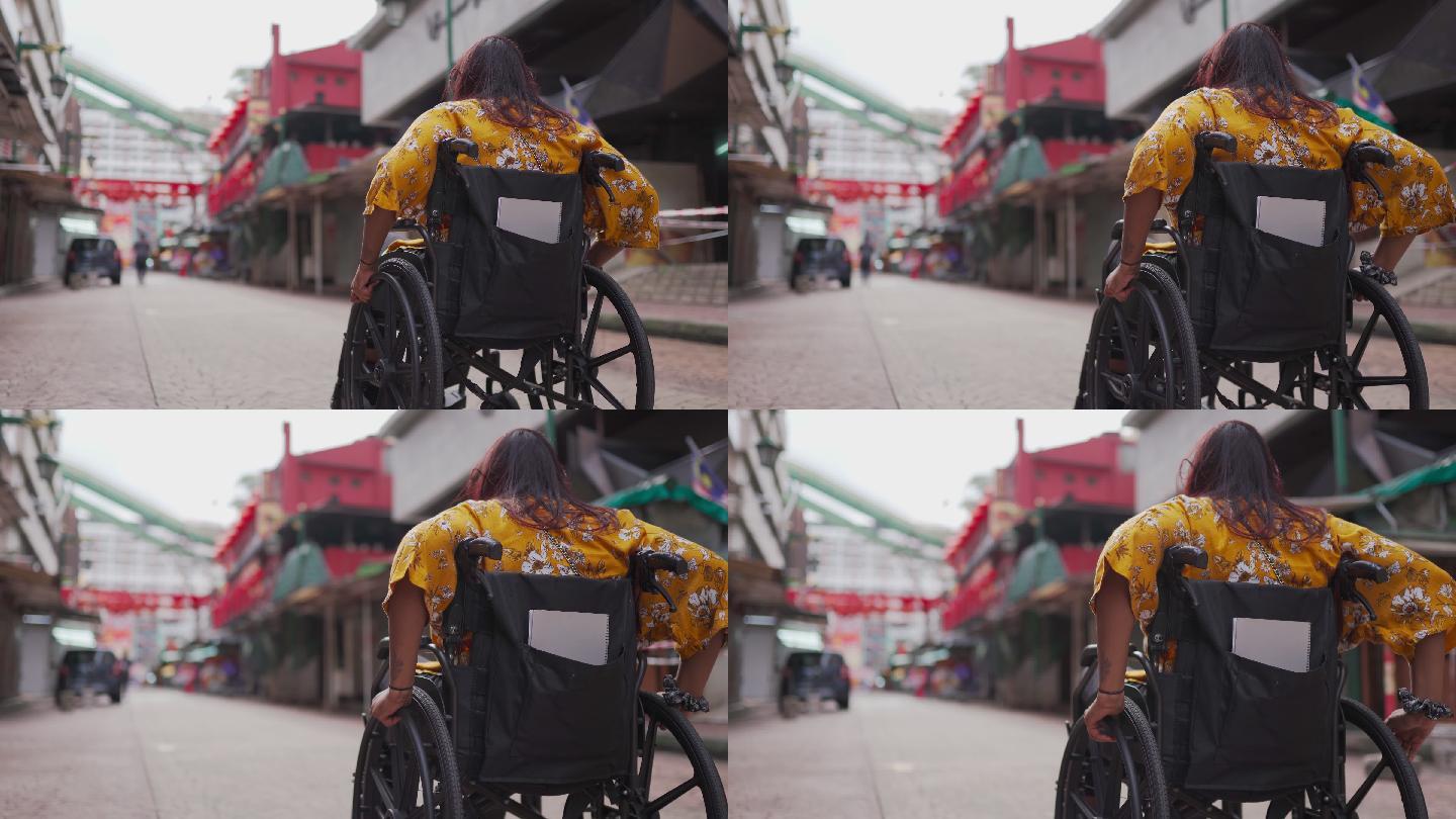 印度残疾美女受伤的女子坐轮椅独自前行