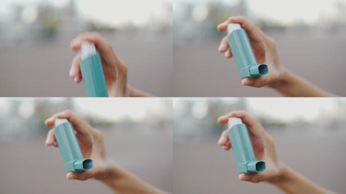 女性使用哮喘吸入器的特写镜头