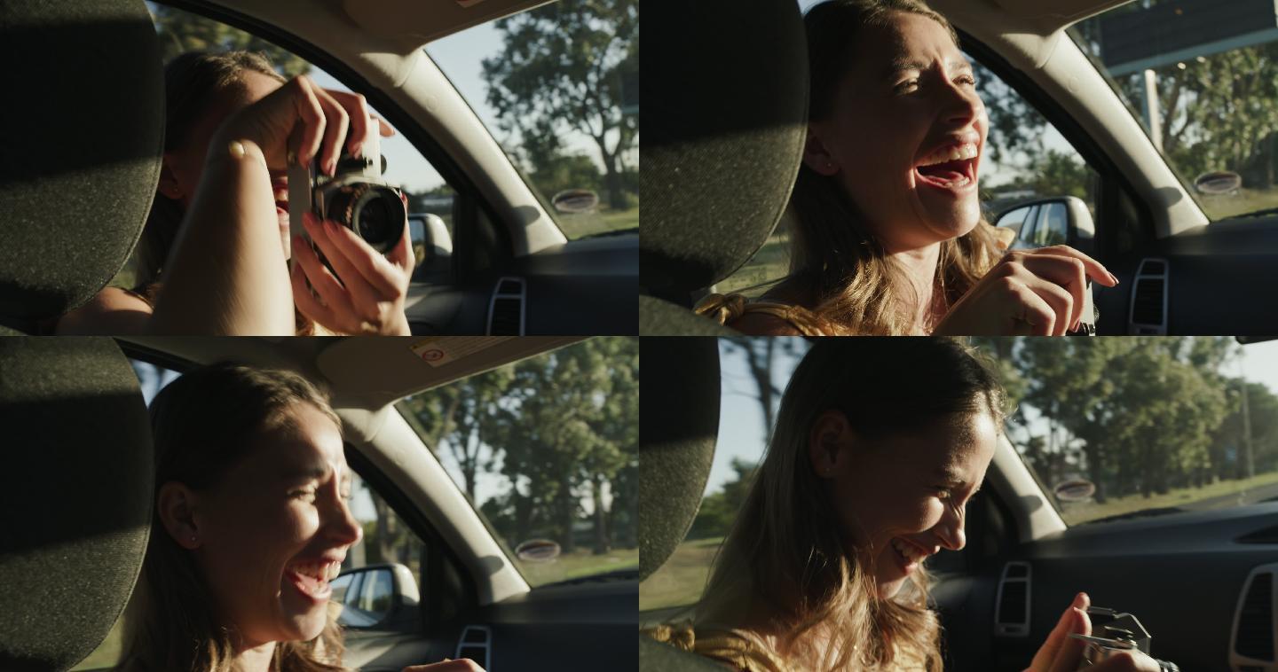 一名年轻女子在车里给男友拍照