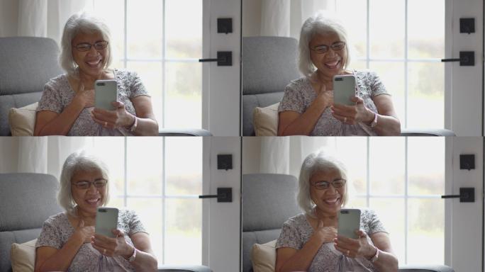 视频通话中的女性老人老年人网络聊天高兴